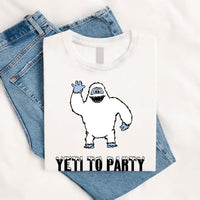 Thumbnail for May include a holiday-themed T-shirt with a cheerful Yeti graphic and a festive “Yeti to Party” phrase in winter colors.