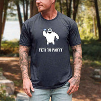 Thumbnail for Man wearing a t-shirt with a yeti graphic and 'Yeti to Party' text in a forest setting