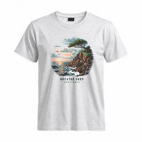 Thumbnail for May include a Sport Grey Breathe Deep Keep It Simple T-Shirt featuring a scenic coastal landscape with ocean waves, rocky cliffs, a windswept tree, and an inspirational nature graphic.
