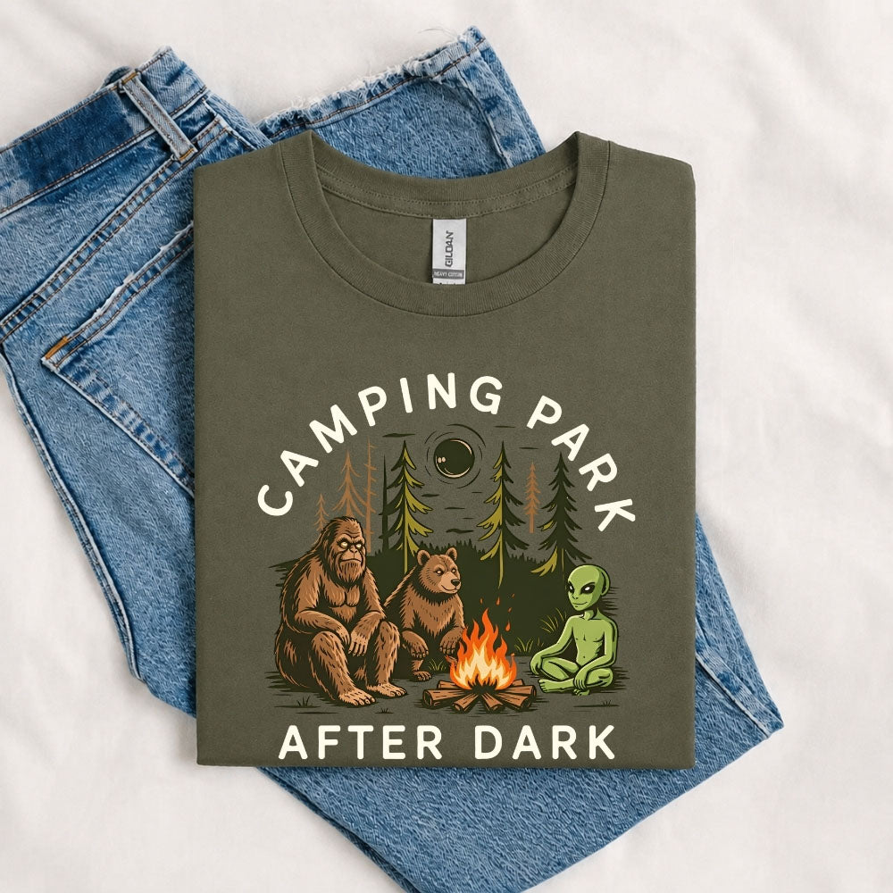May include a Military Green Camping Park After Dark T-Shirt featuring alien, Bigfoot, and bear camping graphics with a nighttime forest scene for campers, hikers, and outdoor adventure enthusiasts.