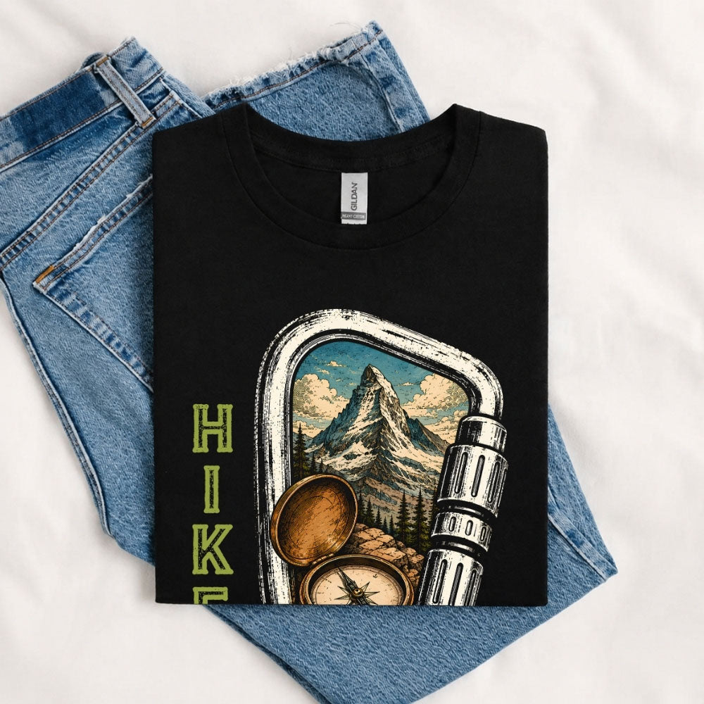 May include a Black person wearing the Carabiner Camping T-Shirt featuring a mountain adventure graphic with a carabiner design for hikers and outdoor enthusiasts.