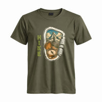 Thumbnail for May include a Military Green person wearing the Carabiner Camping T-Shirt featuring a mountain adventure graphic with a carabiner design for hikers and outdoor enthusiasts.