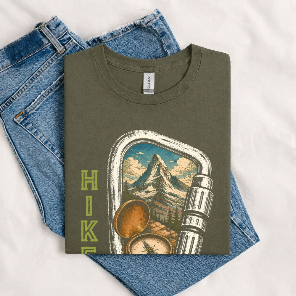 May include a Military Green person wearing the Carabiner Camping T-Shirt featuring a mountain adventure graphic with a carabiner design for hikers and outdoor enthusiasts.