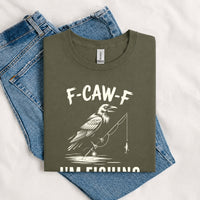 Thumbnail for May include a Military Green funny fishing-themed graphic T-shirt featuring the phrase “F-CAW-F I’m Fishing” with an outdoor angling design.
