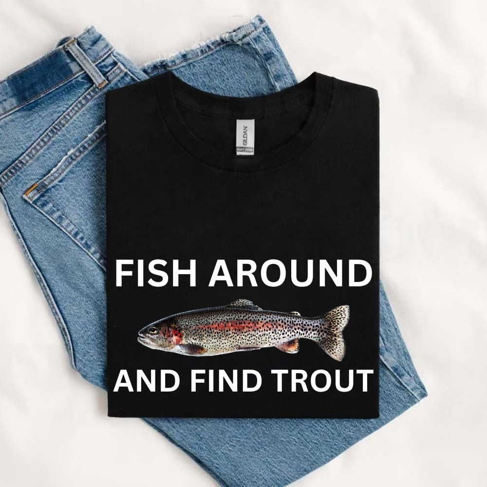 May include a black unisex T-shirt with a colorful trout graphic and bold white text reading “Fish Around and Find Trout,” displayed folded with denim jeans