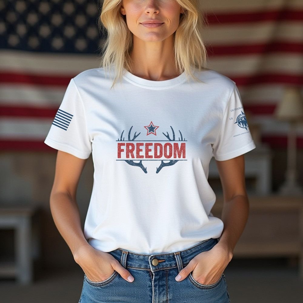 May include person wearing a white Freedom unisex patriotic American liberty t-shirt with bold USA-inspired text design.
