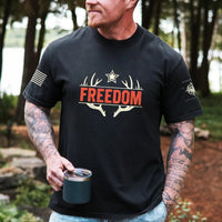 Thumbnail for May include person wearing a pepper Freedom unisex patriotic American liberty t-shirt with bold USA-inspired text design.
