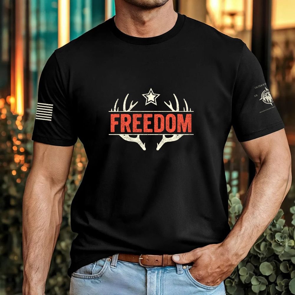 May include person wearing a black Freedom unisex patriotic American liberty t-shirt with bold USA-inspired text design.

