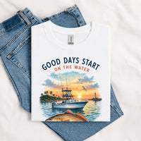 Thumbnail for May include a White Good Days Start on the Water T-Shirt featuring a fishing boat, peaceful sunset, and lake-inspired graphic for anglers, boaters, and outdoor adventure lovers.