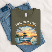 Thumbnail for May include a Military Green Good Days Start on the Water T-Shirt featuring a fishing boat, peaceful sunset, and lake-inspired graphic for anglers, boaters, and outdoor adventure lovers.