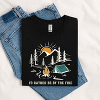 Thumbnail for May include a Black I'd Rather Be by the Fire T-Shirt featuring a cozy campfire-inspired graphic for campers, hikers, RV travelers, and outdoor adventure lovers.