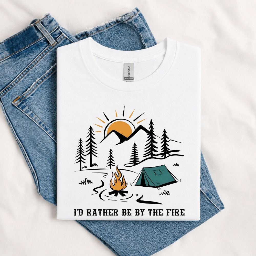 May include a White I'd Rather Be by the Fire T-Shirt featuring a cozy campfire-inspired graphic for campers, hikers, RV travelers, and outdoor adventure lovers.