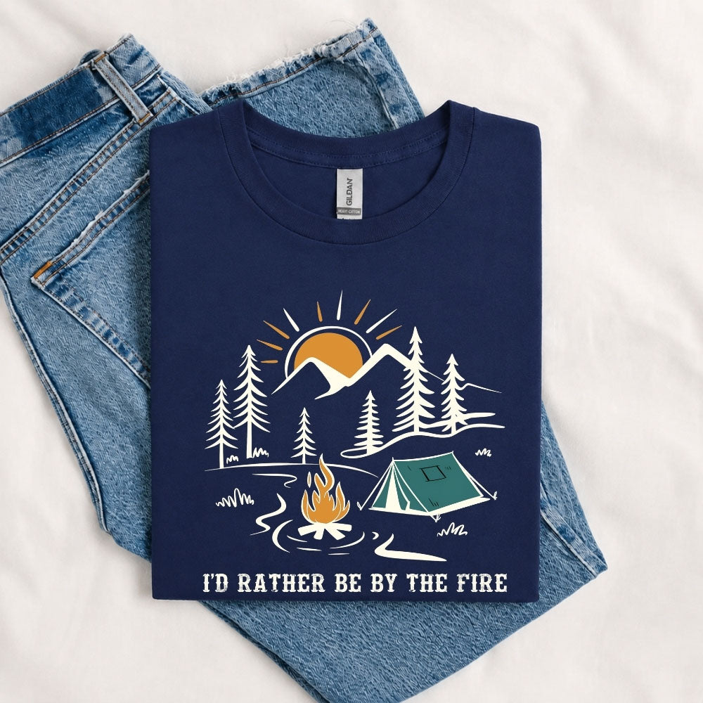 May include a Navy I'd Rather Be by the Fire T-Shirt featuring a cozy campfire-inspired graphic for campers, hikers, RV travelers, and outdoor adventure lovers.
