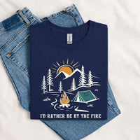 Thumbnail for May include a Navy I'd Rather Be by the Fire T-Shirt featuring a cozy campfire-inspired graphic for campers, hikers, RV travelers, and outdoor adventure lovers.