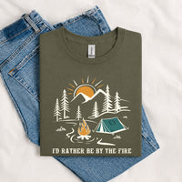 Thumbnail for May include a Military Green I'd Rather Be by the Fire T-Shirt featuring a cozy campfire-inspired graphic for campers, hikers, RV travelers, and outdoor adventure lovers.
