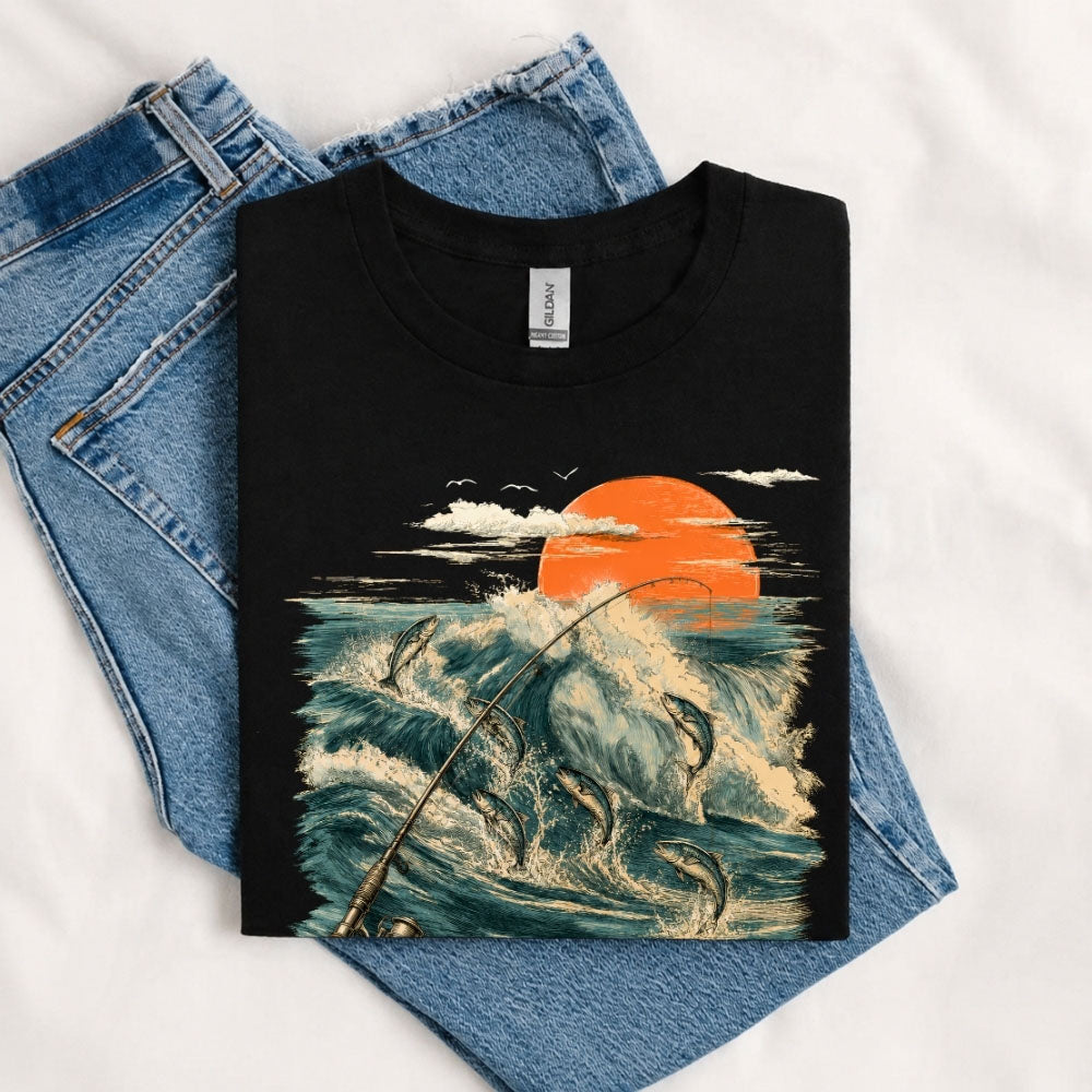 May include a Black Jumping Fish & Ocean Waves T-Shirt featuring a leaping fish, fishing rod, crashing ocean waves, and a vibrant sunset graphic for anglers, boaters, and ocean adventure enthusiasts.