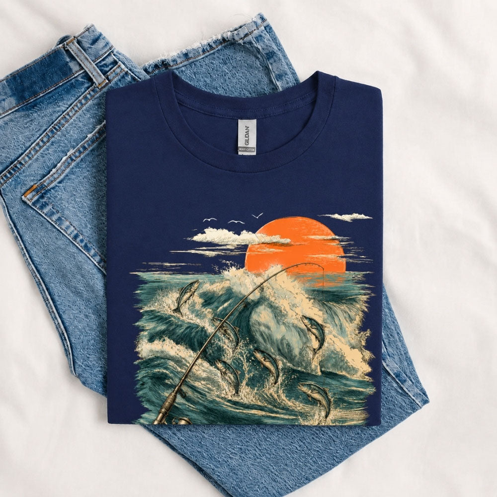 May include a Navy Jumping Fish & Ocean Waves T-Shirt featuring a leaping fish, fishing rod, crashing ocean waves, and a vibrant sunset graphic for anglers, boaters, and ocean adventure enthusiasts.
