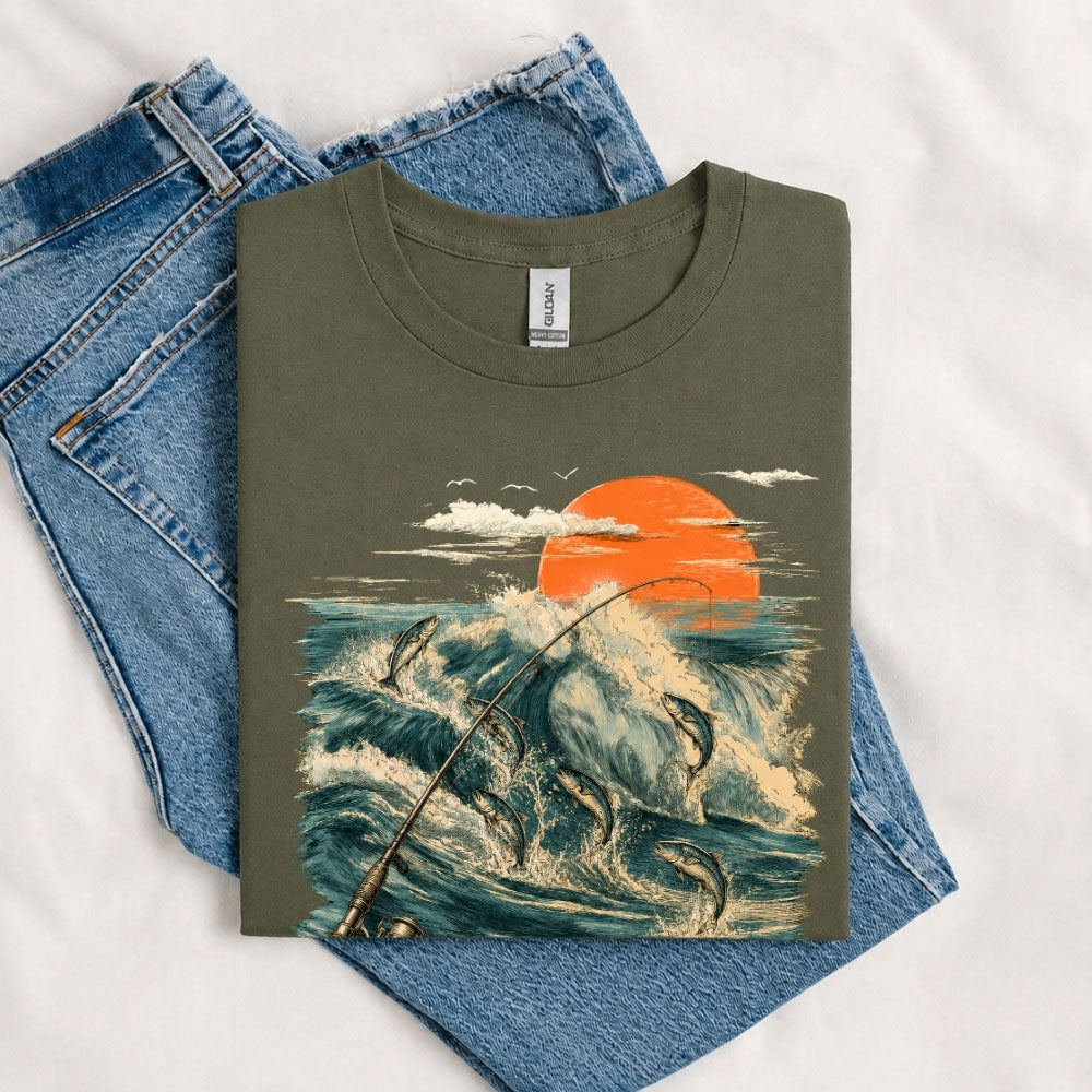 May include a Military Green Jumping Fish & Ocean Waves T-Shirt featuring a leaping fish, fishing rod, crashing ocean waves, and a vibrant sunset graphic for anglers, boaters, and ocean adventure enthusiasts.