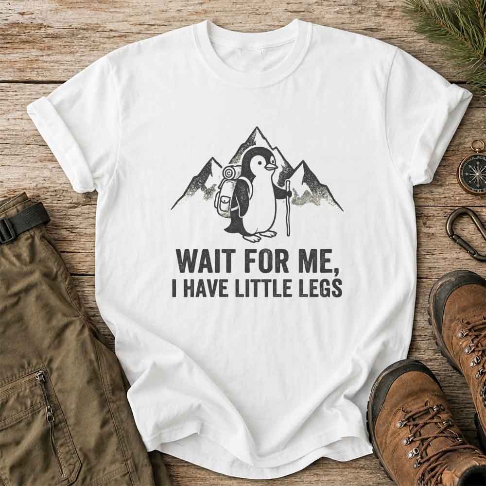 May include a White cute hiking penguin graphic on a casual t-shirt with outdoor adventure style for hikers, campers, and penguin lovers.