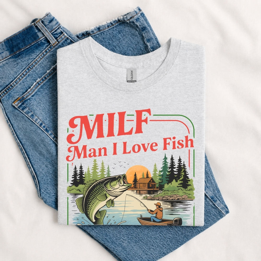 May include a Sport Grey person wearing the MILF Man I Love Fishing T-Shirt featuring a humorous fishing acronym graphic for anglers and outdoor enthusiasts.