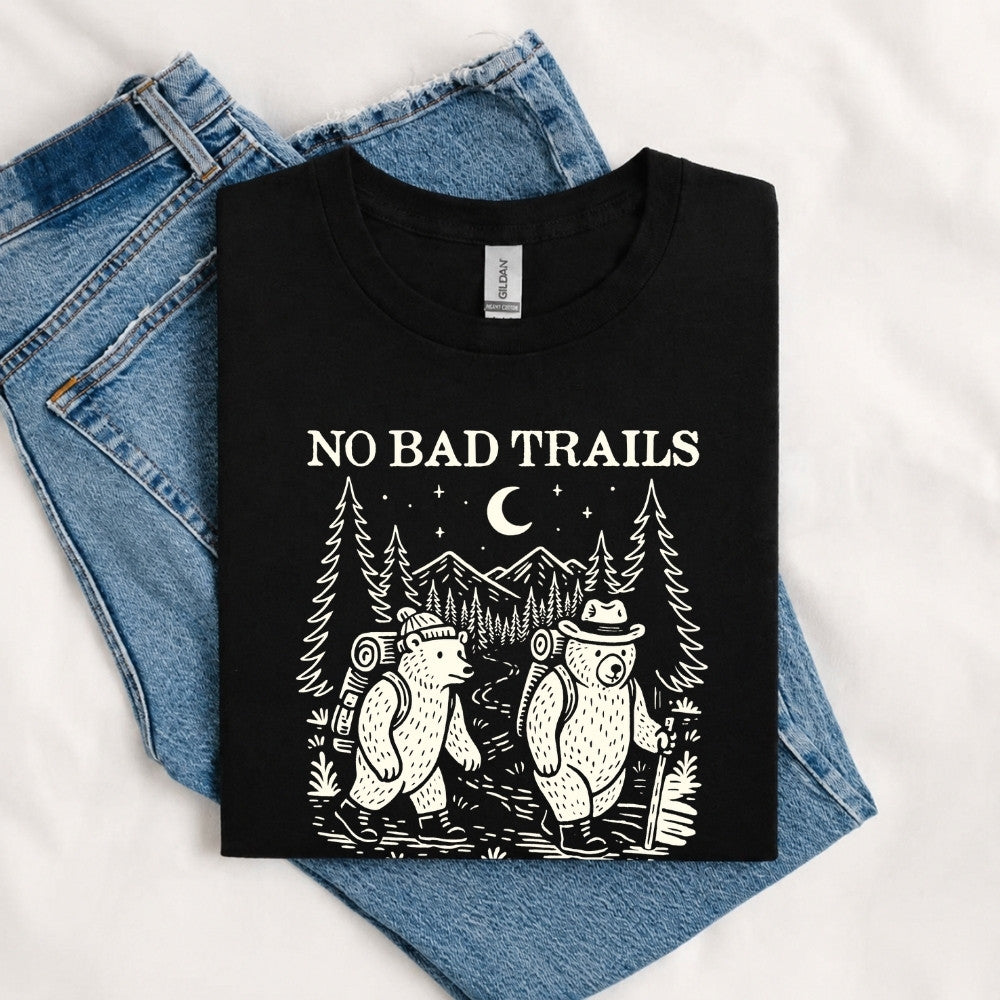 May include a Black humorous hiking quote, mountain trail graphic, outdoor-themed design, casual T-shirt, and funny “No Bad Trails Just Bad Knees” message.