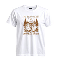 Thumbnail for May include a White humorous hiking quote, mountain trail graphic, outdoor-themed design, casual T-shirt, and funny “No Bad Trails Just Bad Knees” message.