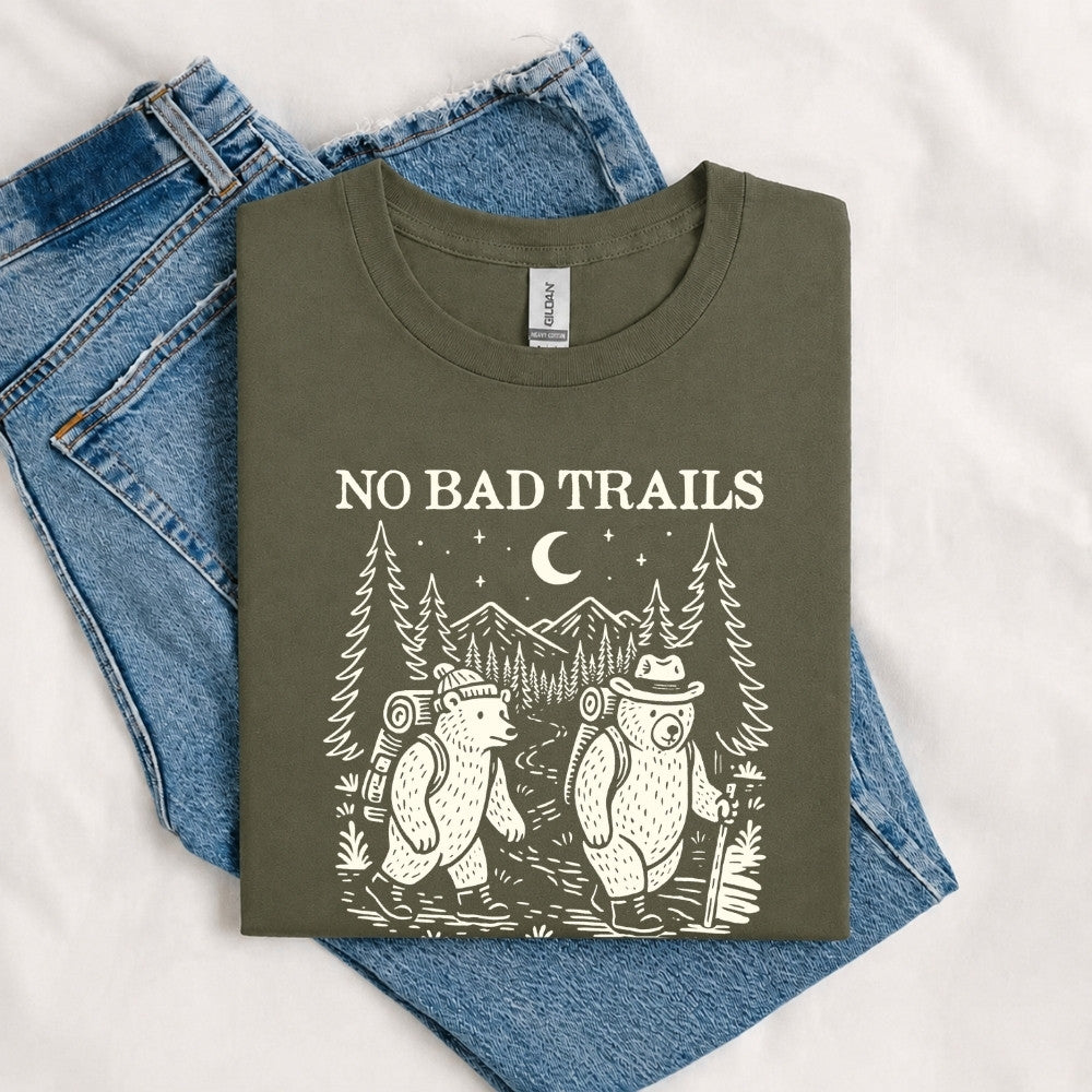 May include a Military Green humorous hiking quote, mountain trail graphic, outdoor-themed design, casual T-shirt, and funny “No Bad Trails Just Bad Knees” message.