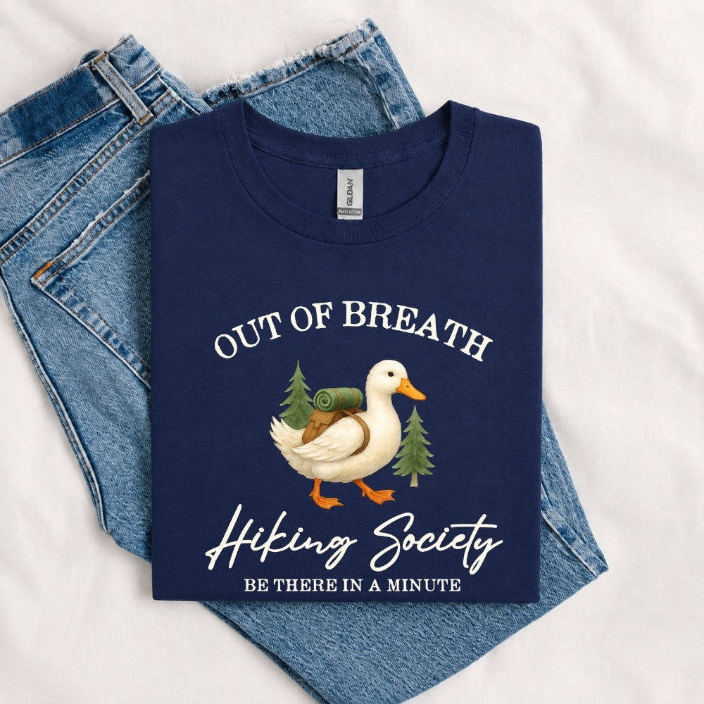 May include a Navy person wearing the Out of Breath Hiking Society T-Shirt featuring a humorous hiking graphic for nature lovers and outdoor enthusiasts.