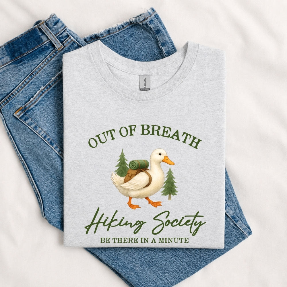 May include a Sport Grey person wearing the Out of Breath Hiking Society T-Shirt featuring a humorous hiking graphic for nature lovers and outdoor enthusiasts.