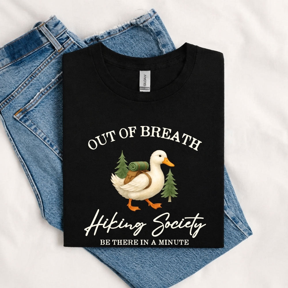May include a Black person wearing the Out of Breath Hiking Society T-Shirt featuring a humorous hiking graphic for nature lovers and outdoor enthusiasts.