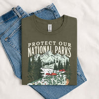 Thumbnail for May include a Military Green Protect Our National Parks Fish X River Graphic T-Shirt featuring a fish silhouette with a scenic river landscape for anglers, hikers, campers, and nature lovers.