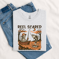 Thumbnail for May include a Sport Grey person wearing the Reel Scared Halloween T-Shirt featuring a funny fishing-inspired Halloween graphic for spooky season celebrations.