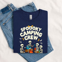 Thumbnail for May include a Navy Spooky Camping Crew T-Shirt featuring a funny Halloween camping graphic with festive fall elements for campers and outdoor enthusiasts.