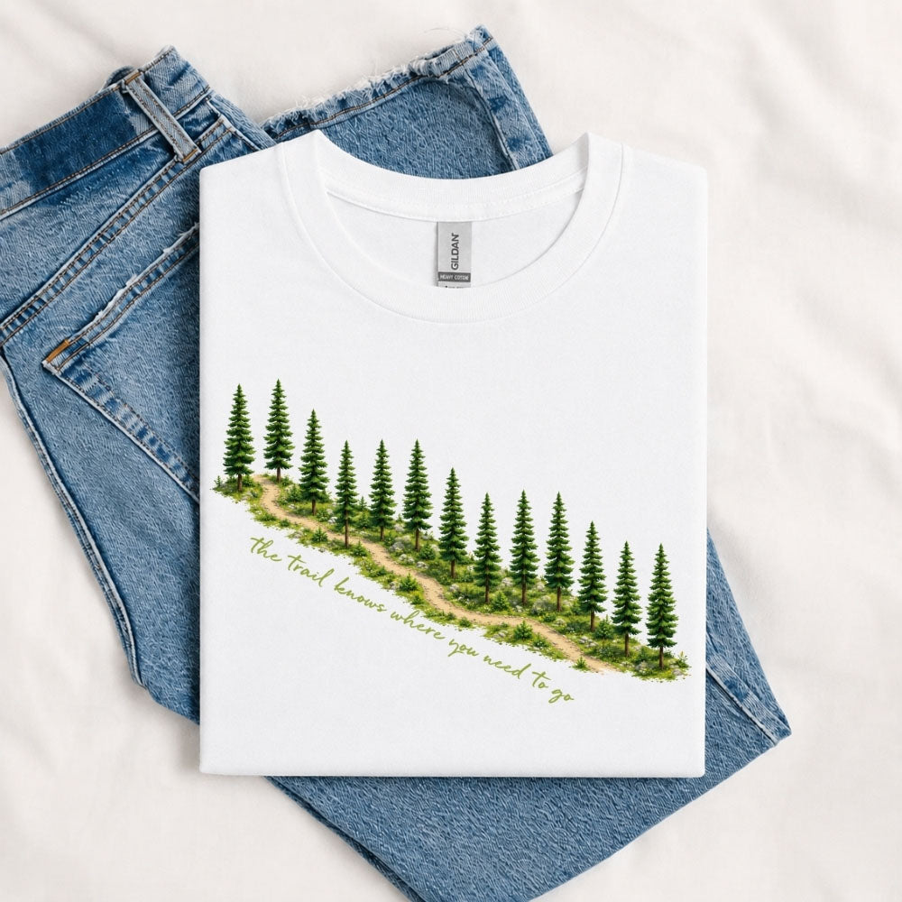 May include a White The Trail Knows Where You Need to Go T-Shirt featuring an inspirational hiking graphic with outdoor adventure artwork for hikers, campers, backpackers, and nature lovers.