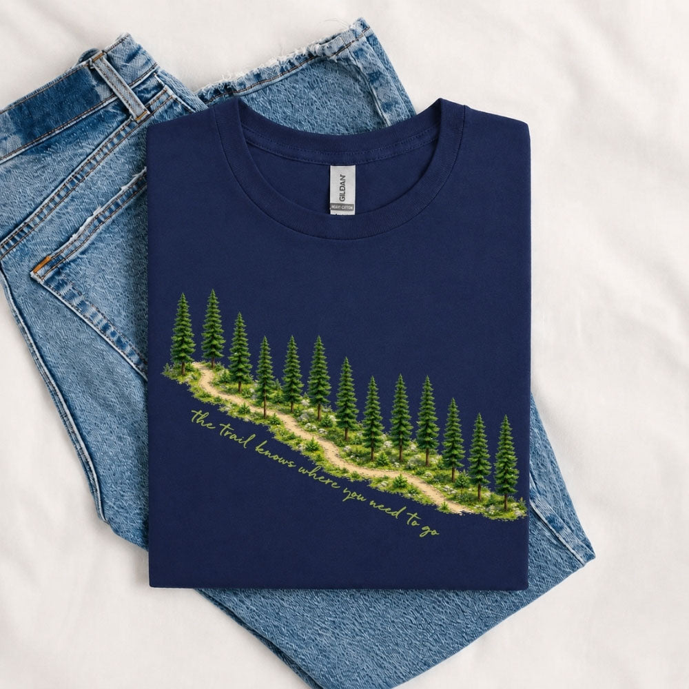 May include a Navy The Trail Knows Where You Need to Go T-Shirt featuring an inspirational hiking graphic with outdoor adventure artwork for hikers, campers, backpackers, and nature lovers.