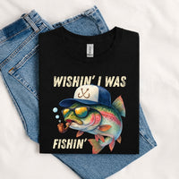 Thumbnail for May include a Black Wishin' I Was Fishin' T-Shirt featuring a fishing-inspired graphic for anglers, boaters, lake lovers, and outdoor enthusiasts.